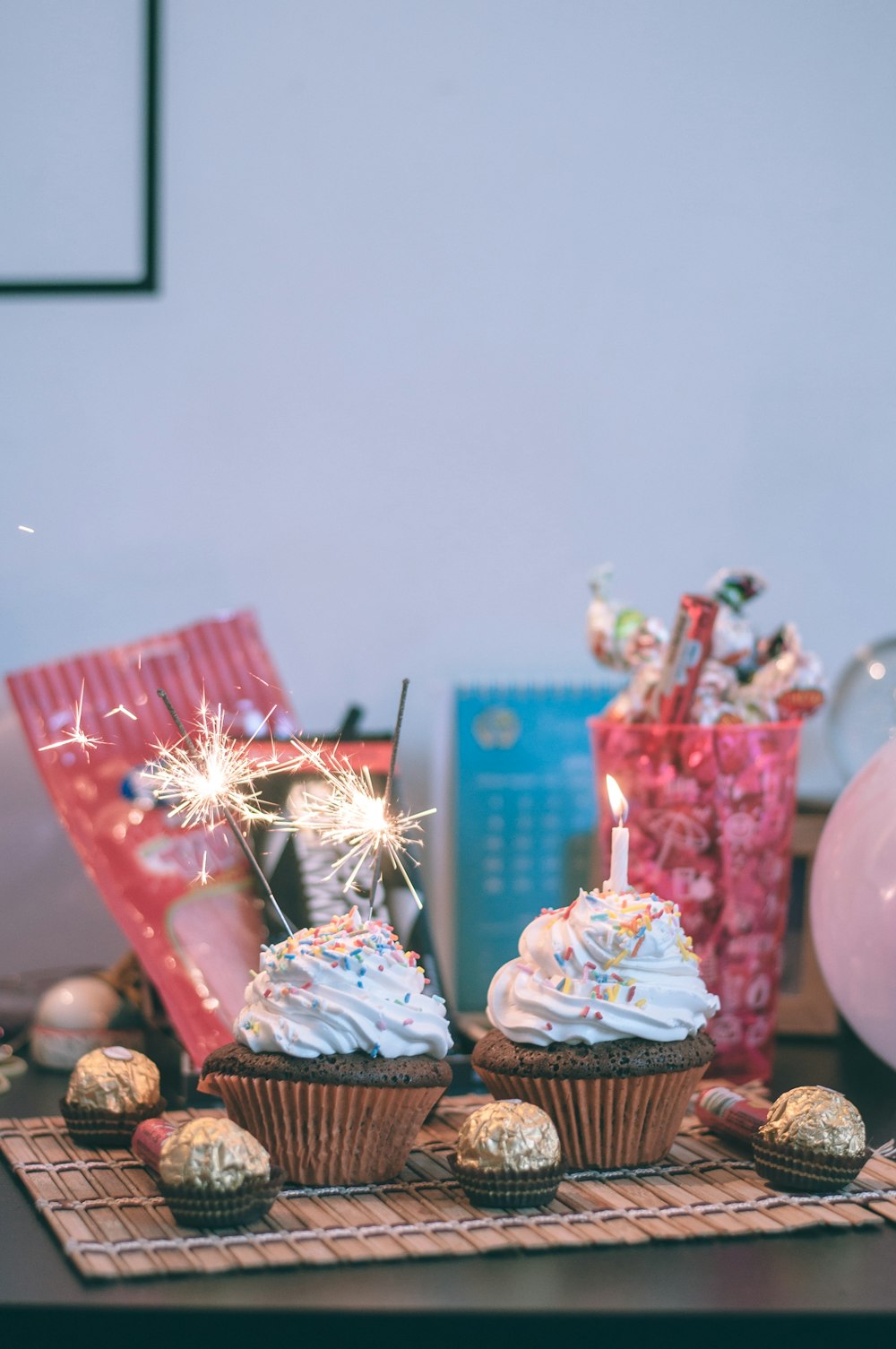 candles and sparkler on cupcakes