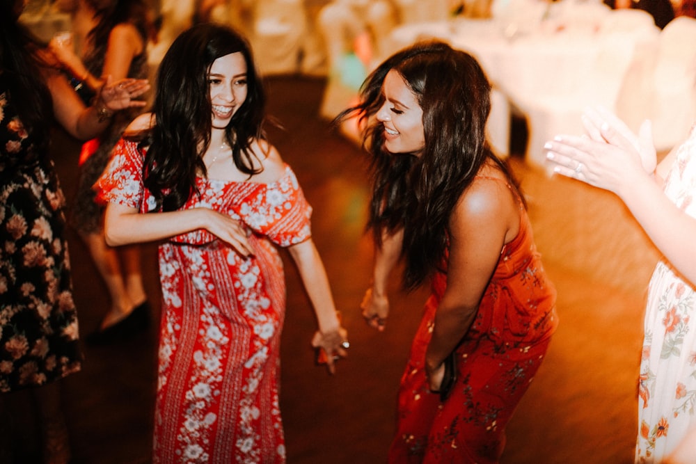 two women dancing on floor