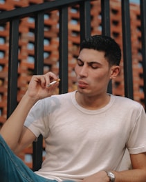 man holding cigarette