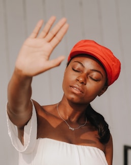 woman raising right hand