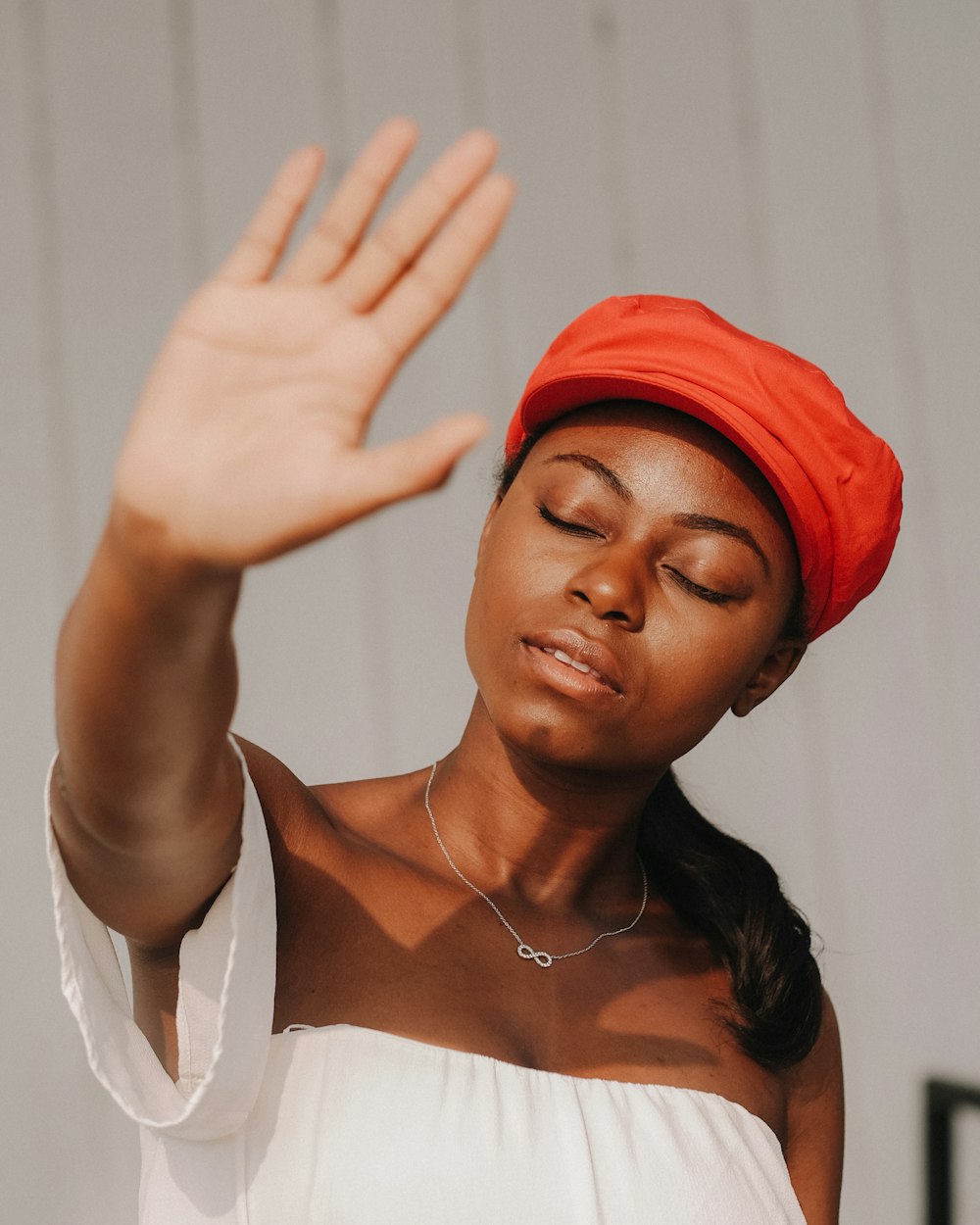 woman raising right hand