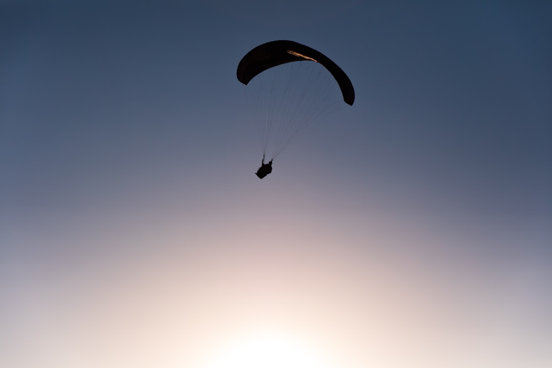person in parachute during daytime