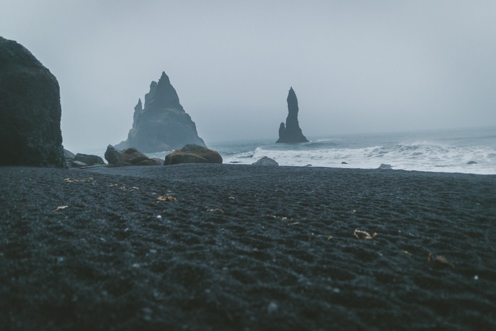 ocean shore under cloudy sky during daytime