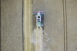 white tractor on gray field