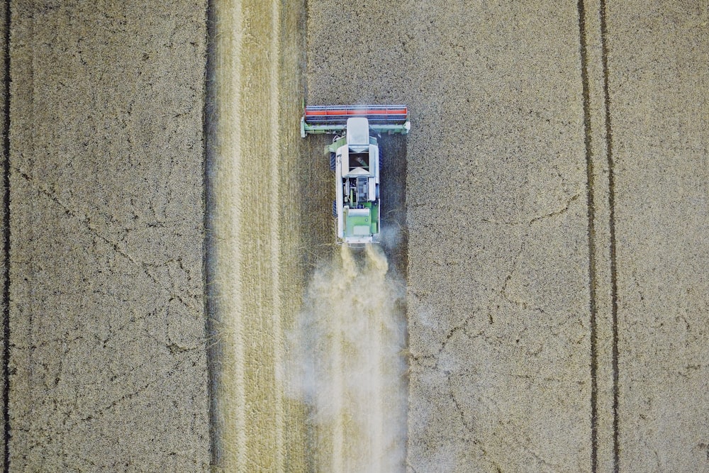 white tractor on gray field