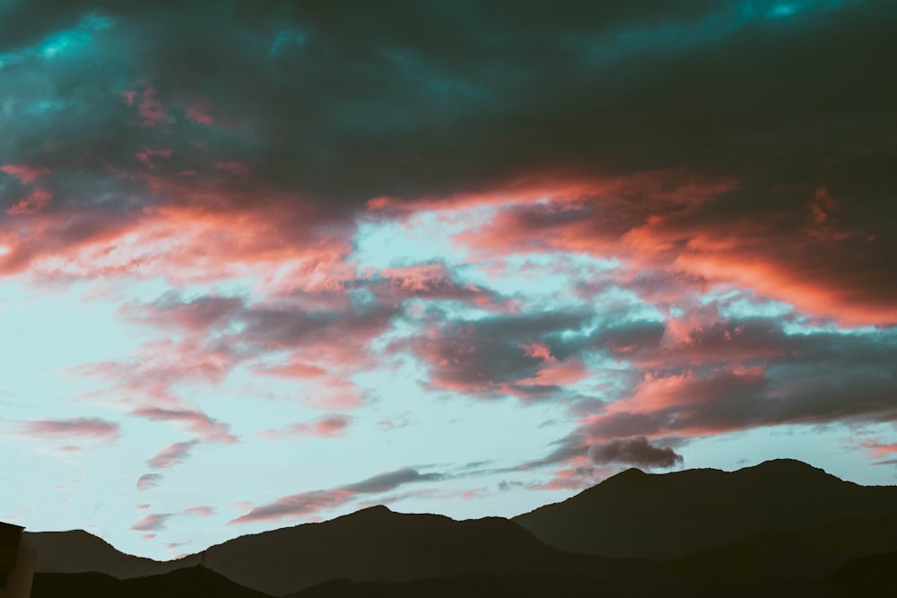 mountains under clouds