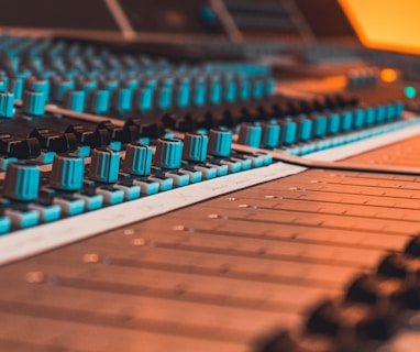 blue and black audio mixer in close-up photography