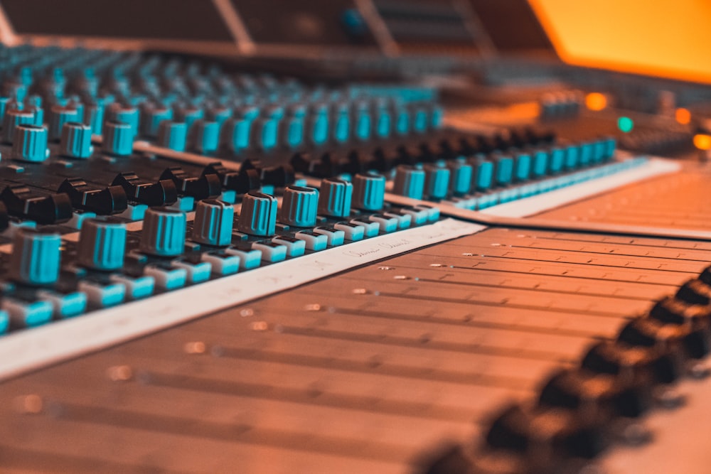 blue and black audio mixer in close-up photography