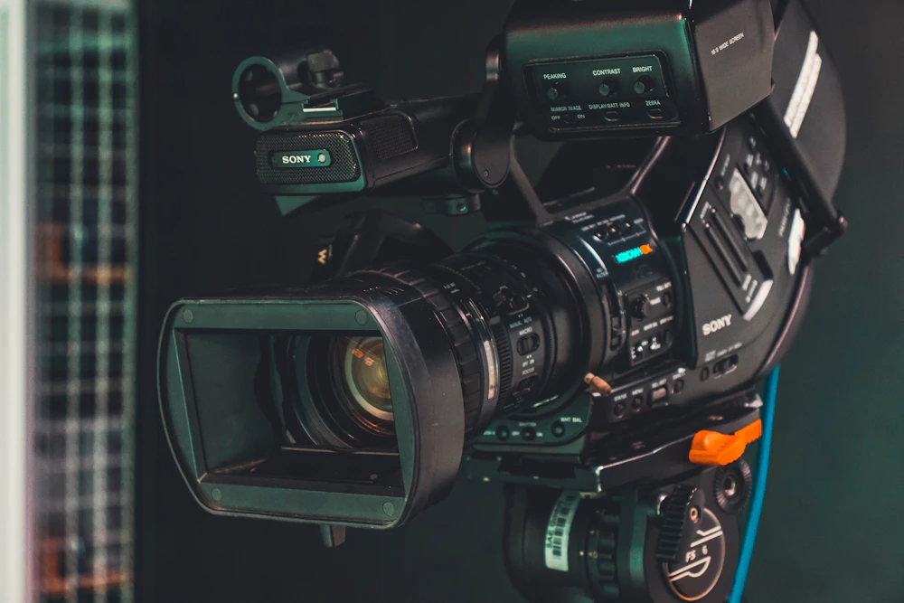 Live sports broadcast camera operator on the sideline