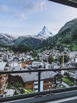 aerial photography of houses near mountains at daytime