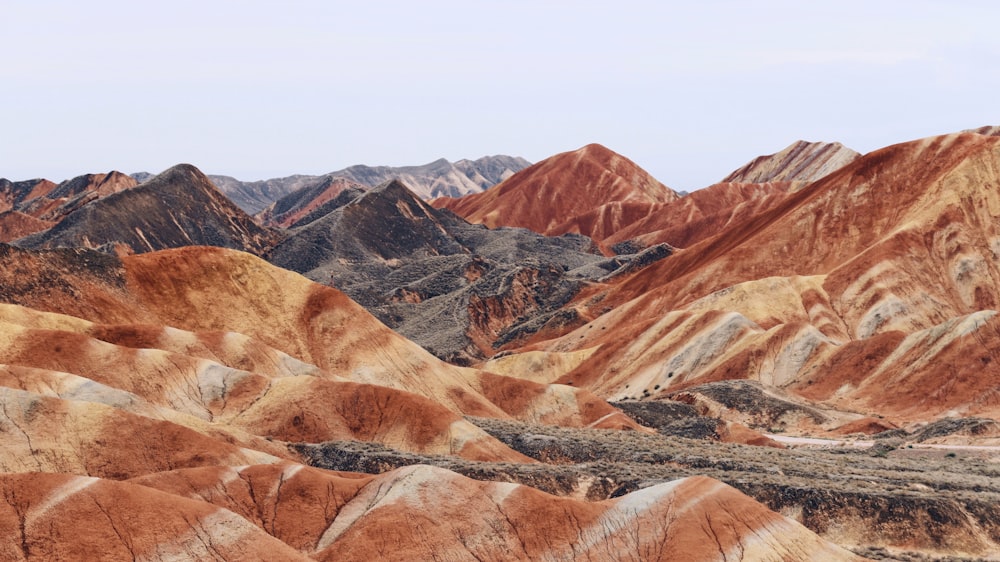 brown and orange mountains under blue sky