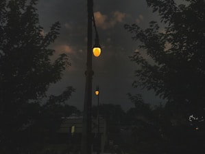 Street lighting installation powered by renewable energy sources at dusk.