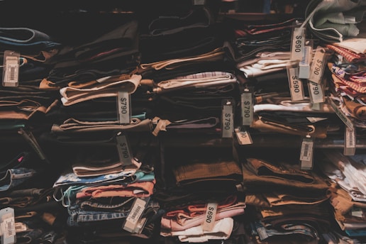 Industrial warehouse storing unused fabric bolts awaiting resale