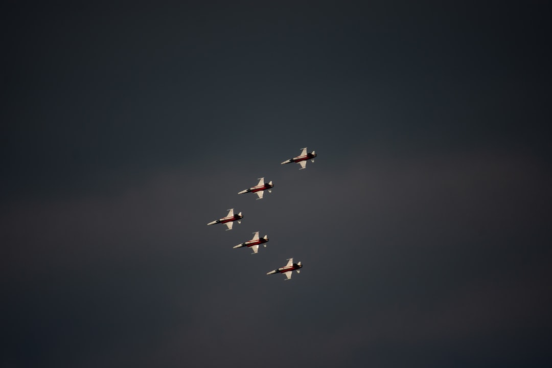 five airplanes having a formation, Airshow for Arboner Classics. We see here the Swiss Patrouille in a Formation
