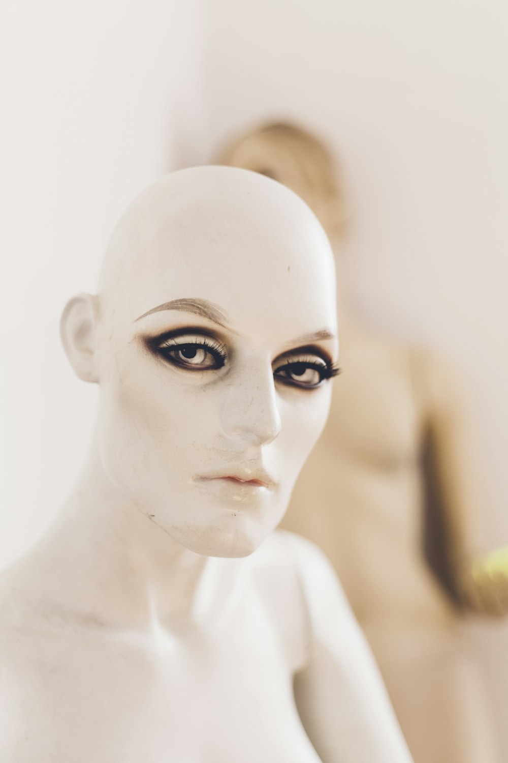 tilt shift lens photography of mannequin