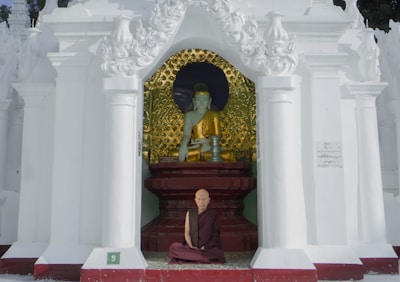A peaceful Zen meditation session inside a quiet temple with a monk.