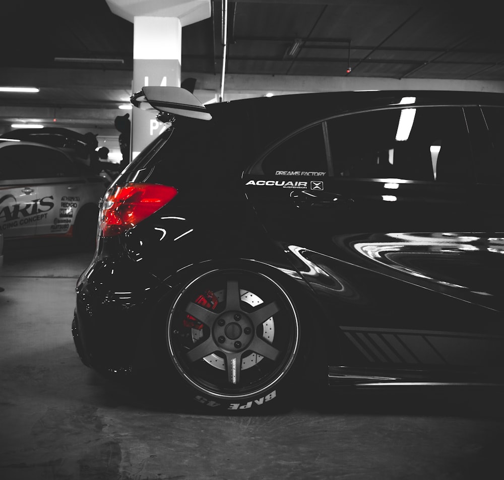 black 5-door hatchback on parking lot