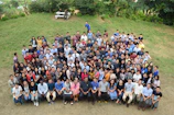 Group photo of church members smiling after a recent outdoor fellowship picnic.