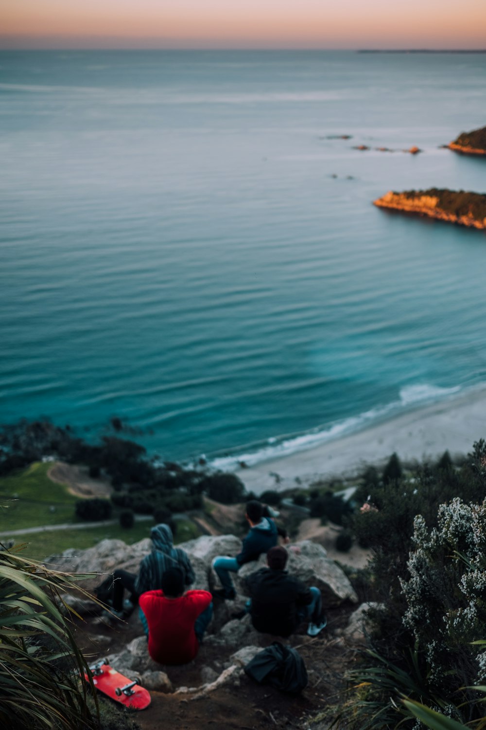 people overlooking sea