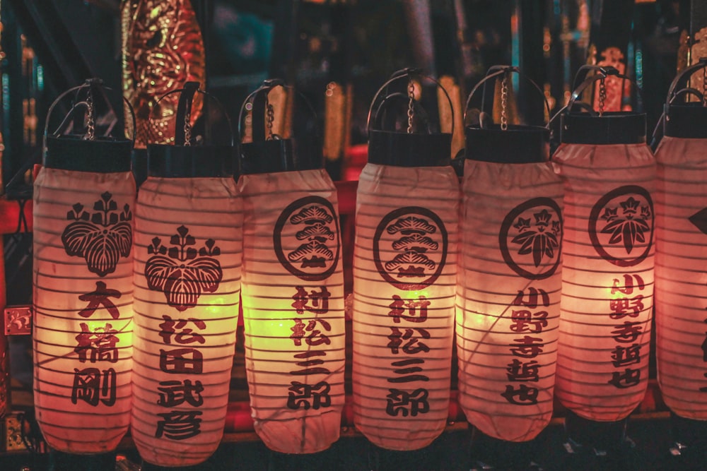 paper lanterns hanging on black steel hook