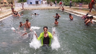 A group of friends enjoying the sauna and cold plunge setup during a lively outdoor gathering.