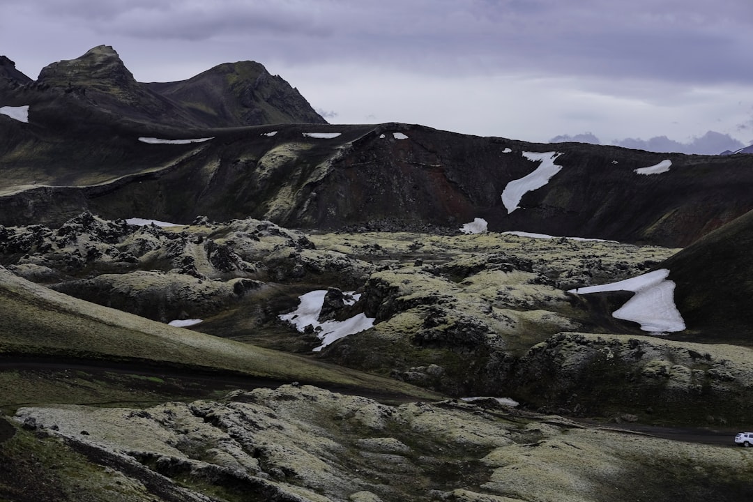 mountain under grey clouds