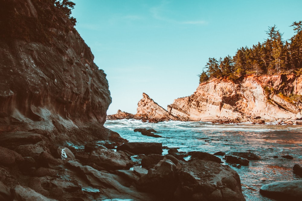 body of water in between of rock formation