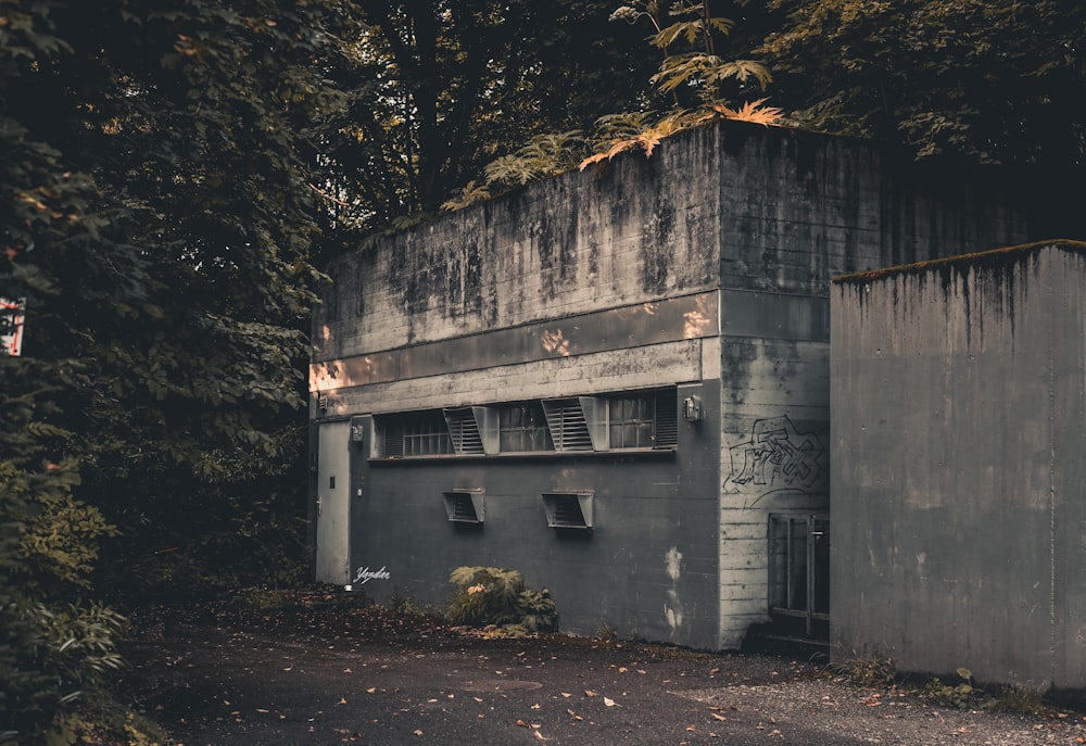 gray concrete house near trees