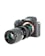 A professional digital camera with a large lens attached, featuring a sleek black body and various adjustment dials. The brand logo is visible on the upper part of the camera.