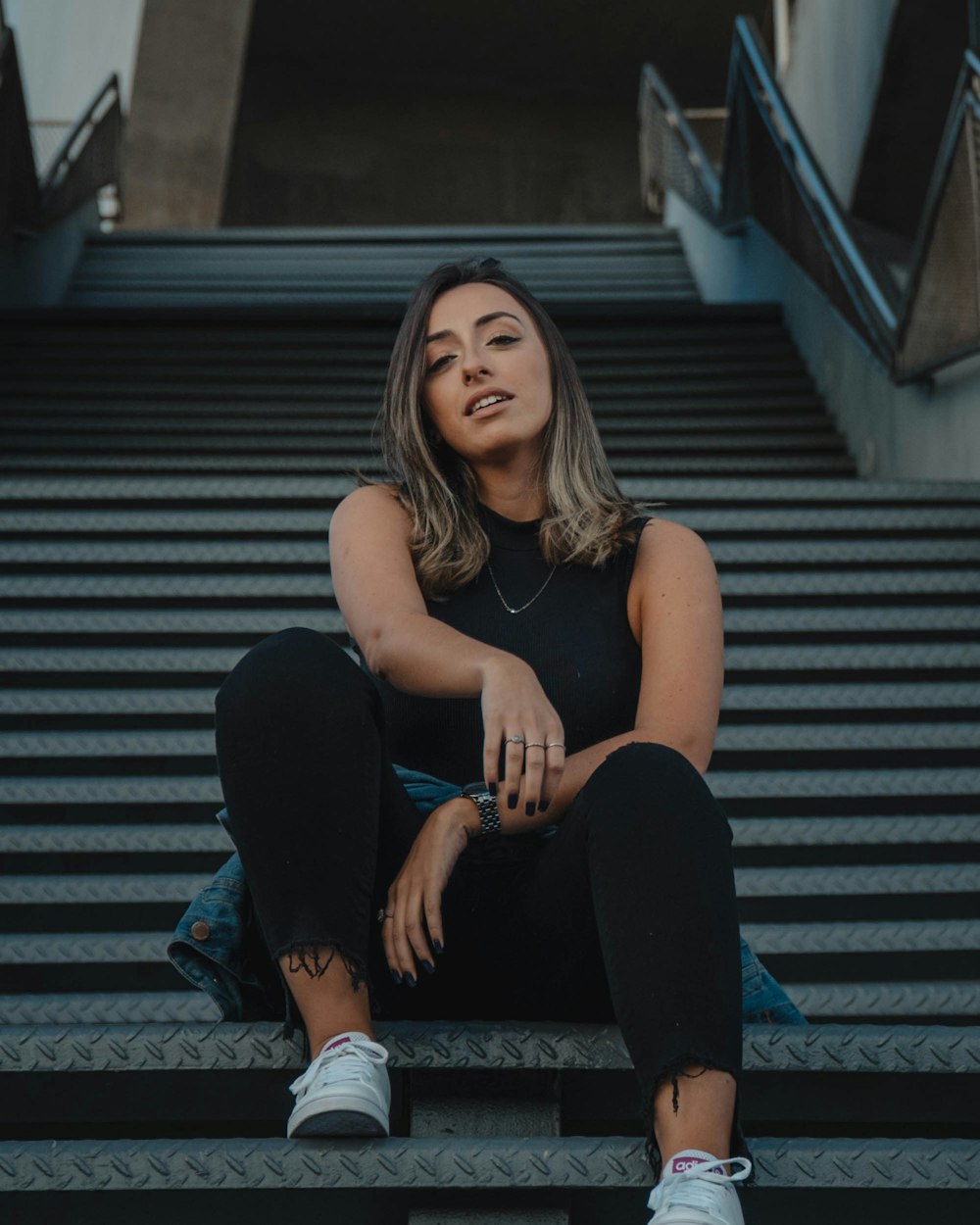 woman sitting on stairs