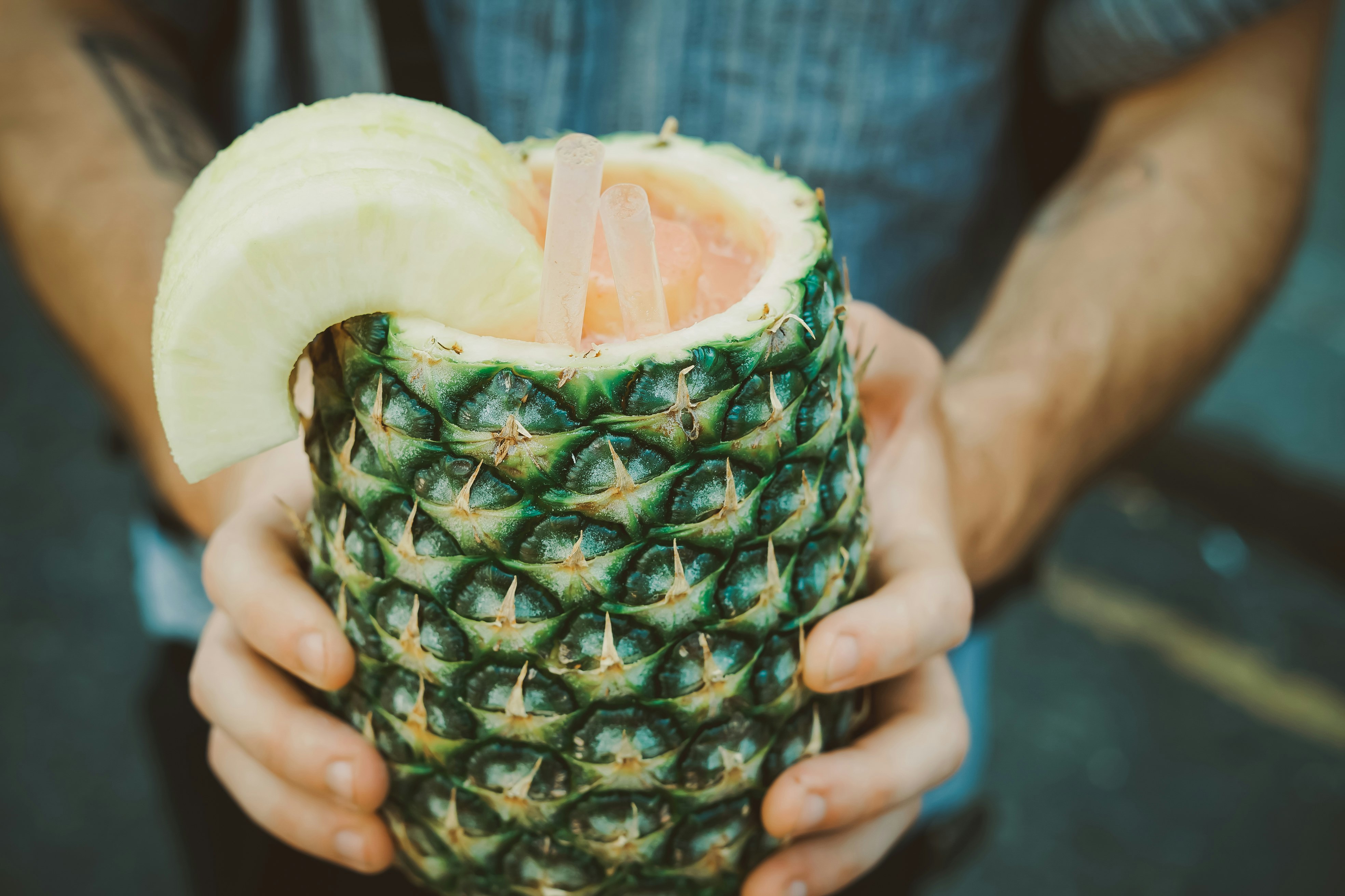 person holding carving pineapple