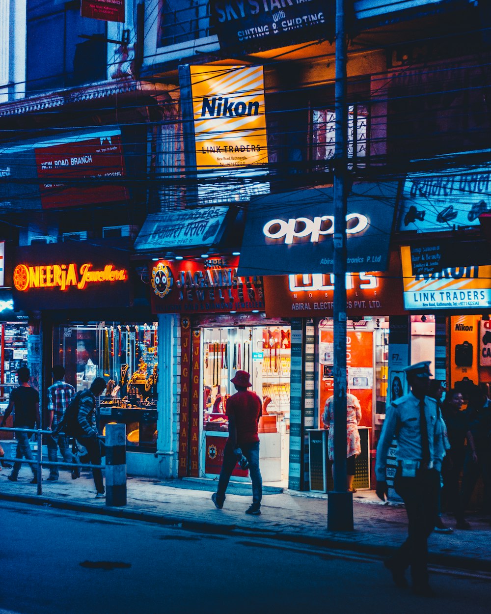 man walking beside OPPO front store