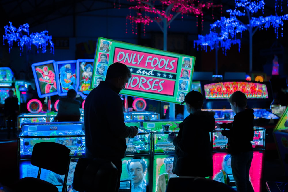 people in front clear glass desk with lights