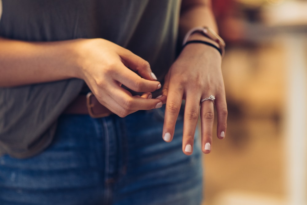 a close up of a person holding a ring