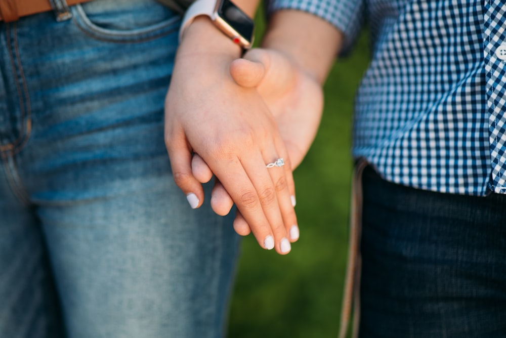 two person holding hands