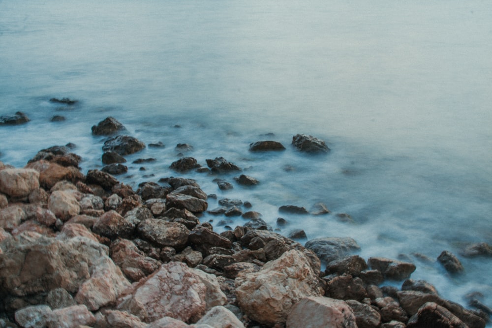 close-up photo of rocks near seashore