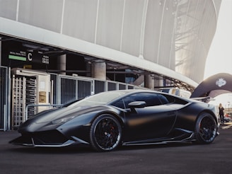 sports car in front of stadium