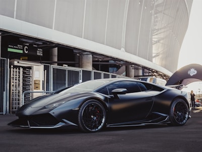 sports car in front of stadium