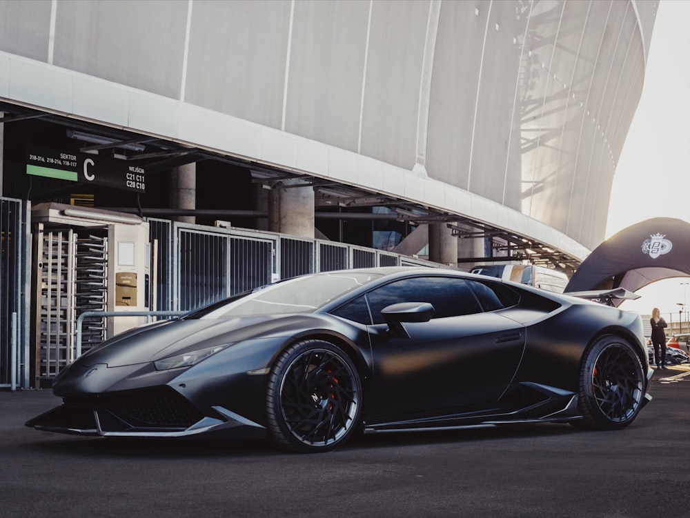 sports car in front of stadium