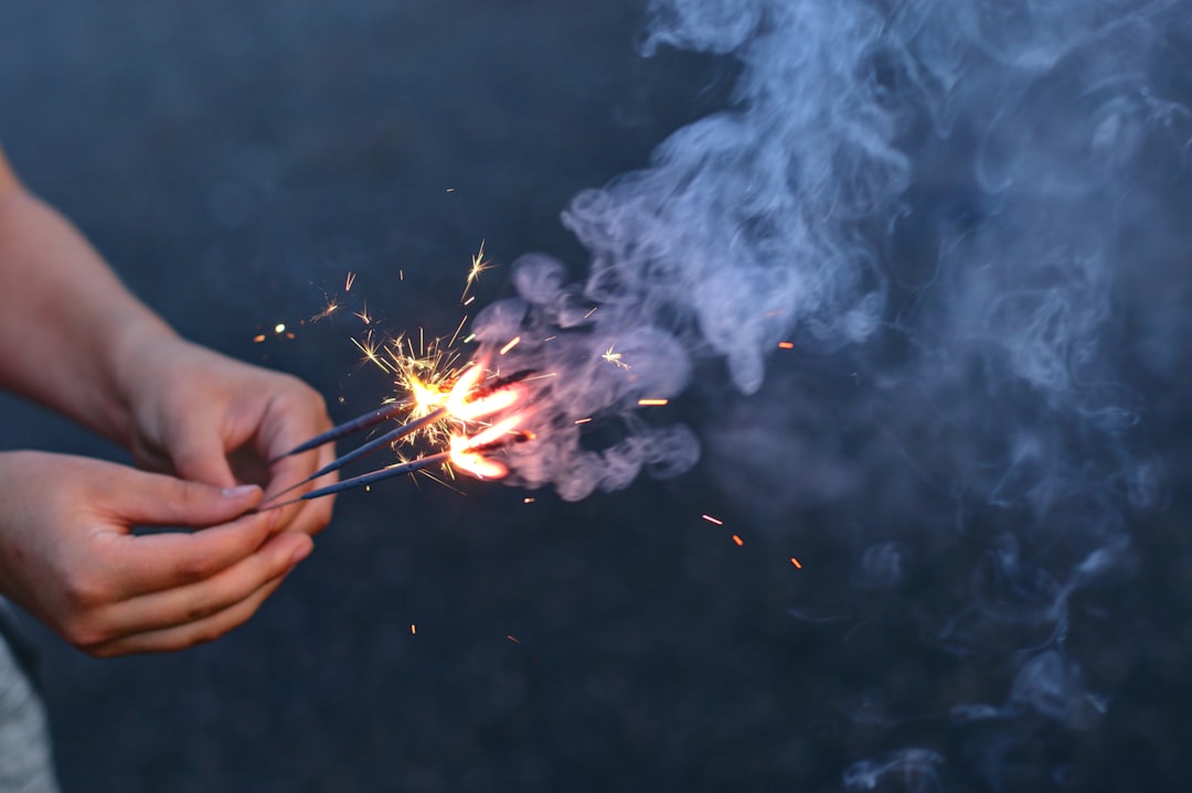 person holding sparklers