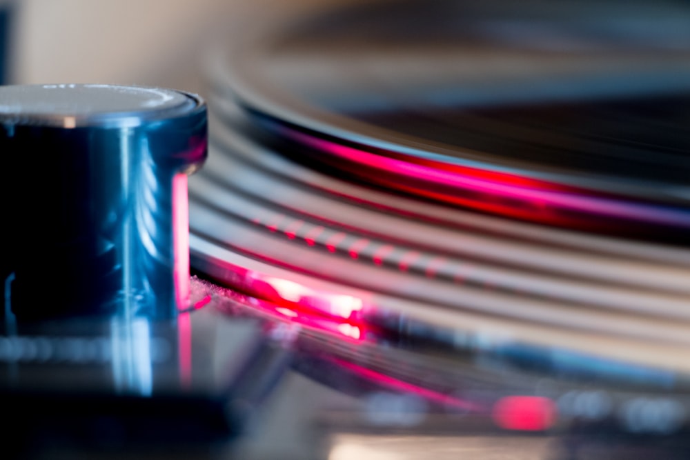a close up of a record player with a blurry background