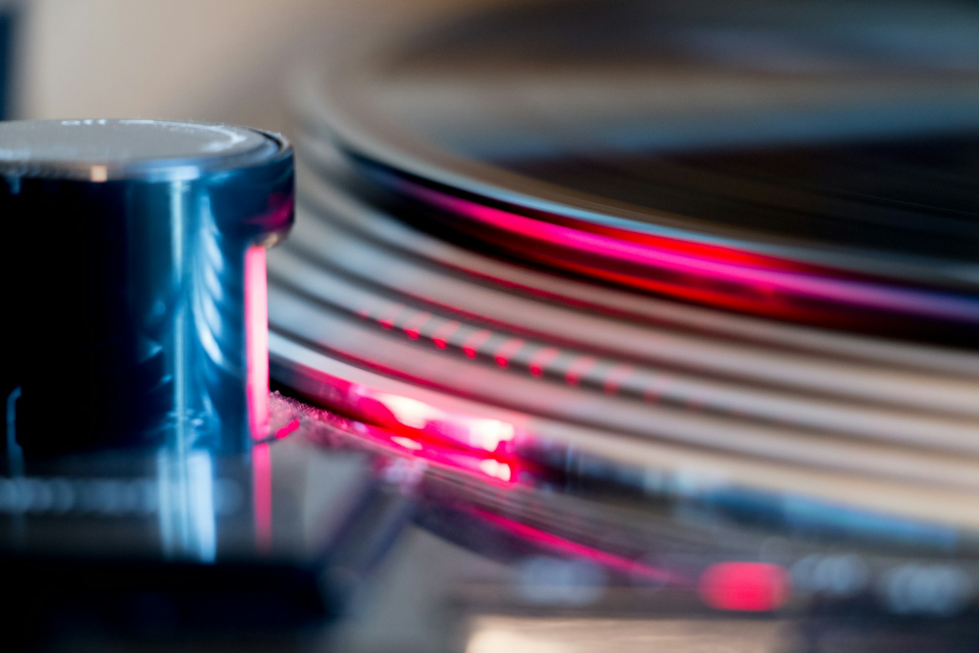 a close up of a record player with a blurry background