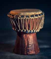 selective focus photography of brown djembe instrument