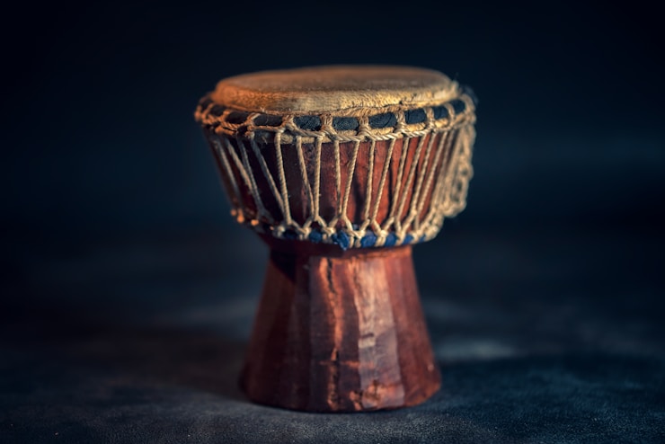 selective focus photography of brown djembe instrument