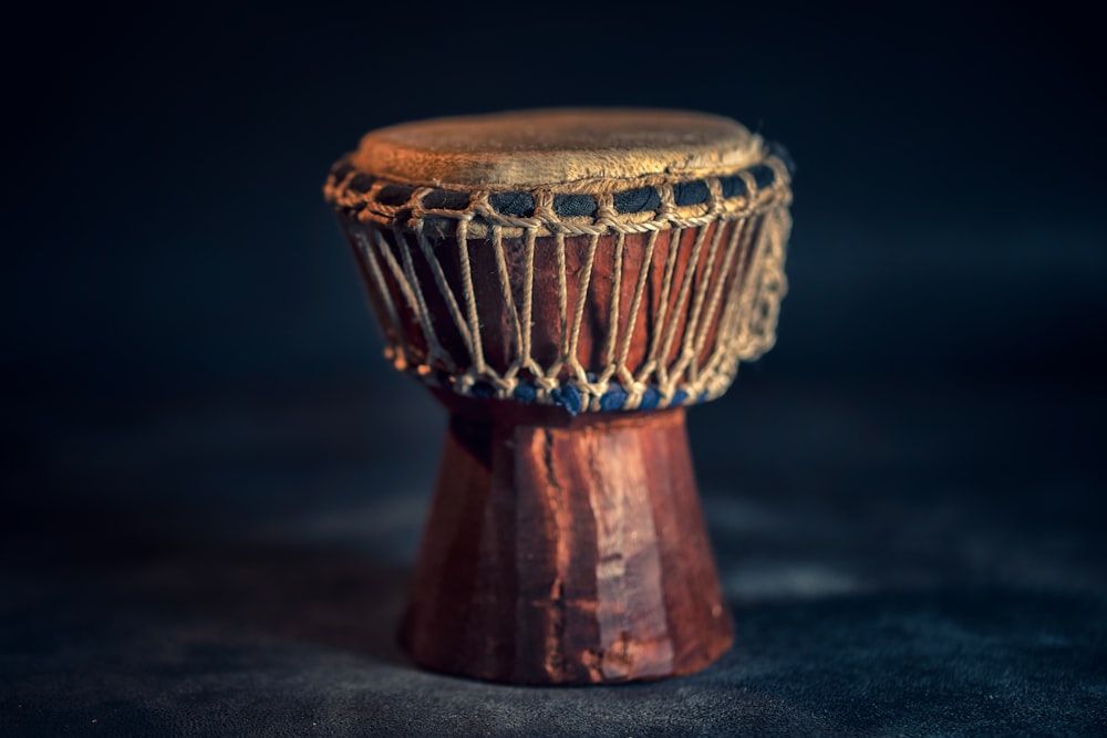 selective focus photography of brown djembe instrument