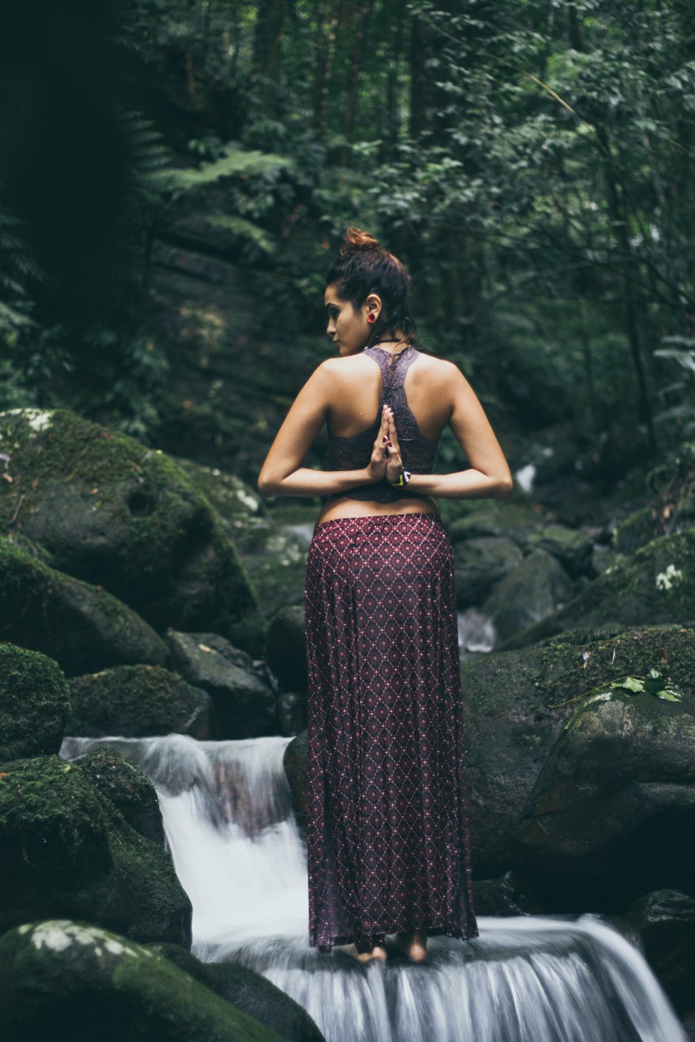 woman twisting her arms to her back