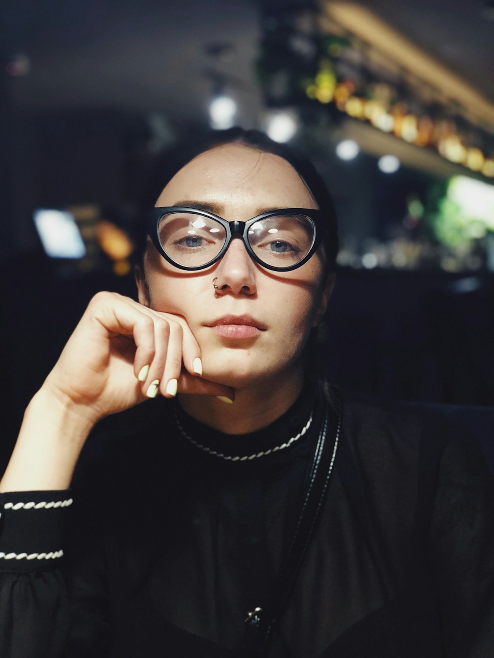 selective focus photography of woman wearing black eyeglasses