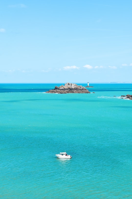 photograph of white yacht on sea in Pointe du Grouin France