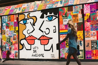woman walking passes graffiti