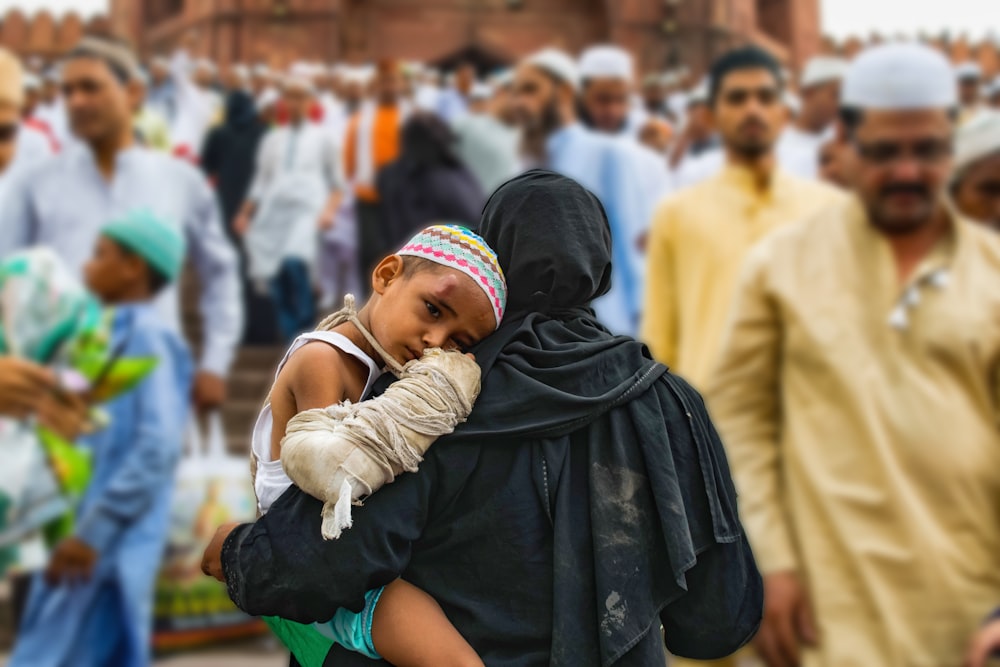 woman holding a boy